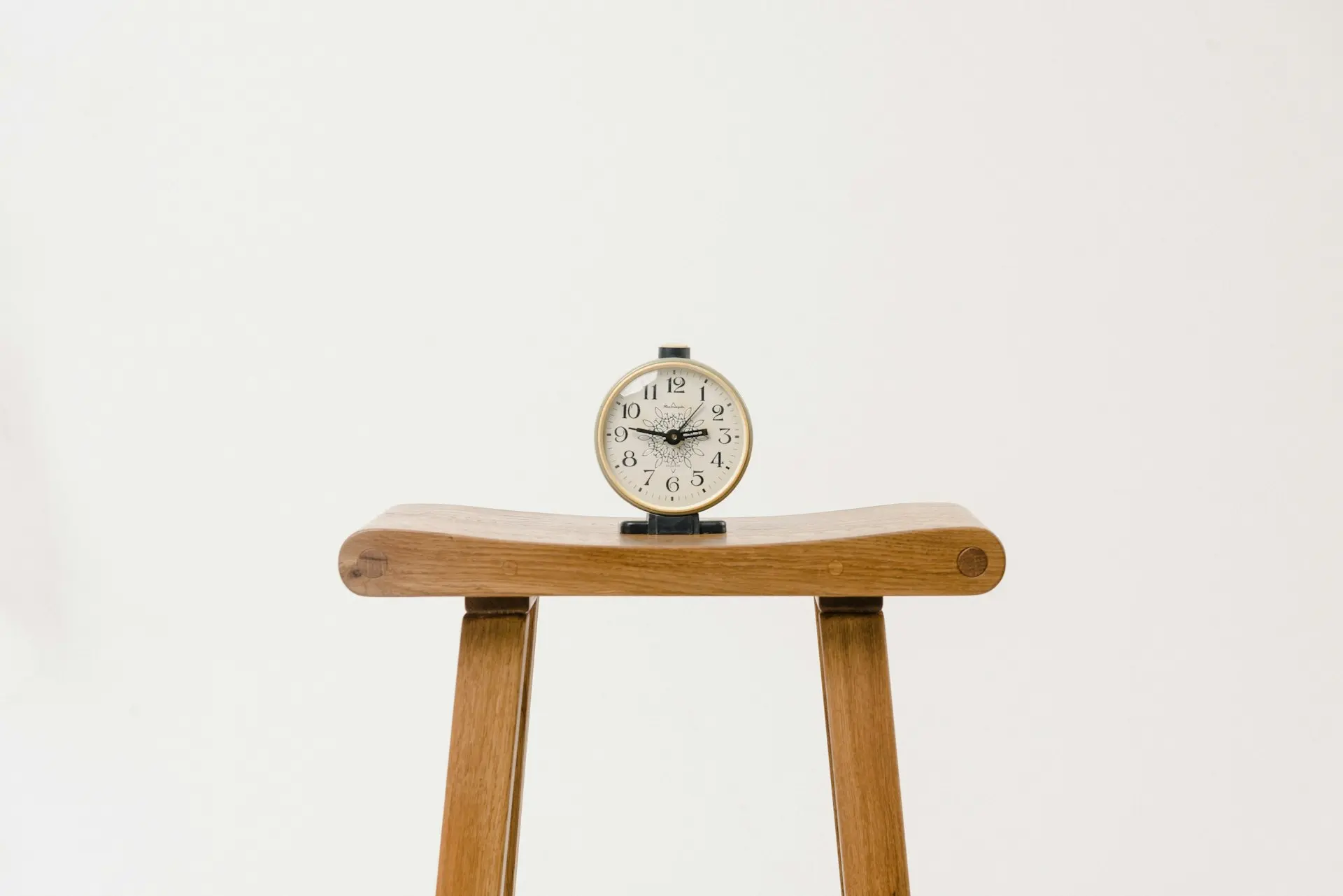 brown wooden table clock at 10 10